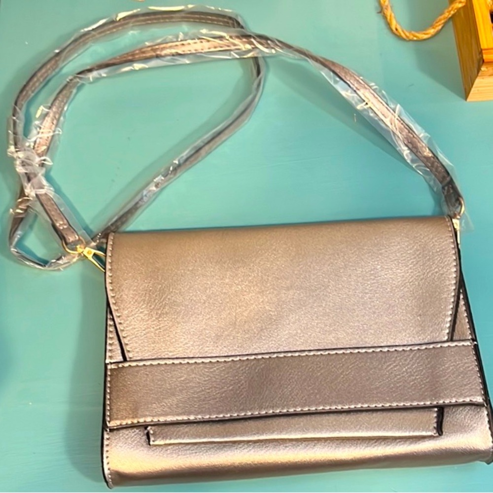 Silver summer & rose brand purse with strap. Brand new, never used.